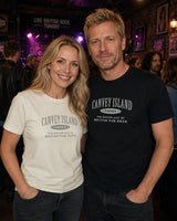 Two people wearing 'Canvey Island' t-shirts standing together in a social setting.