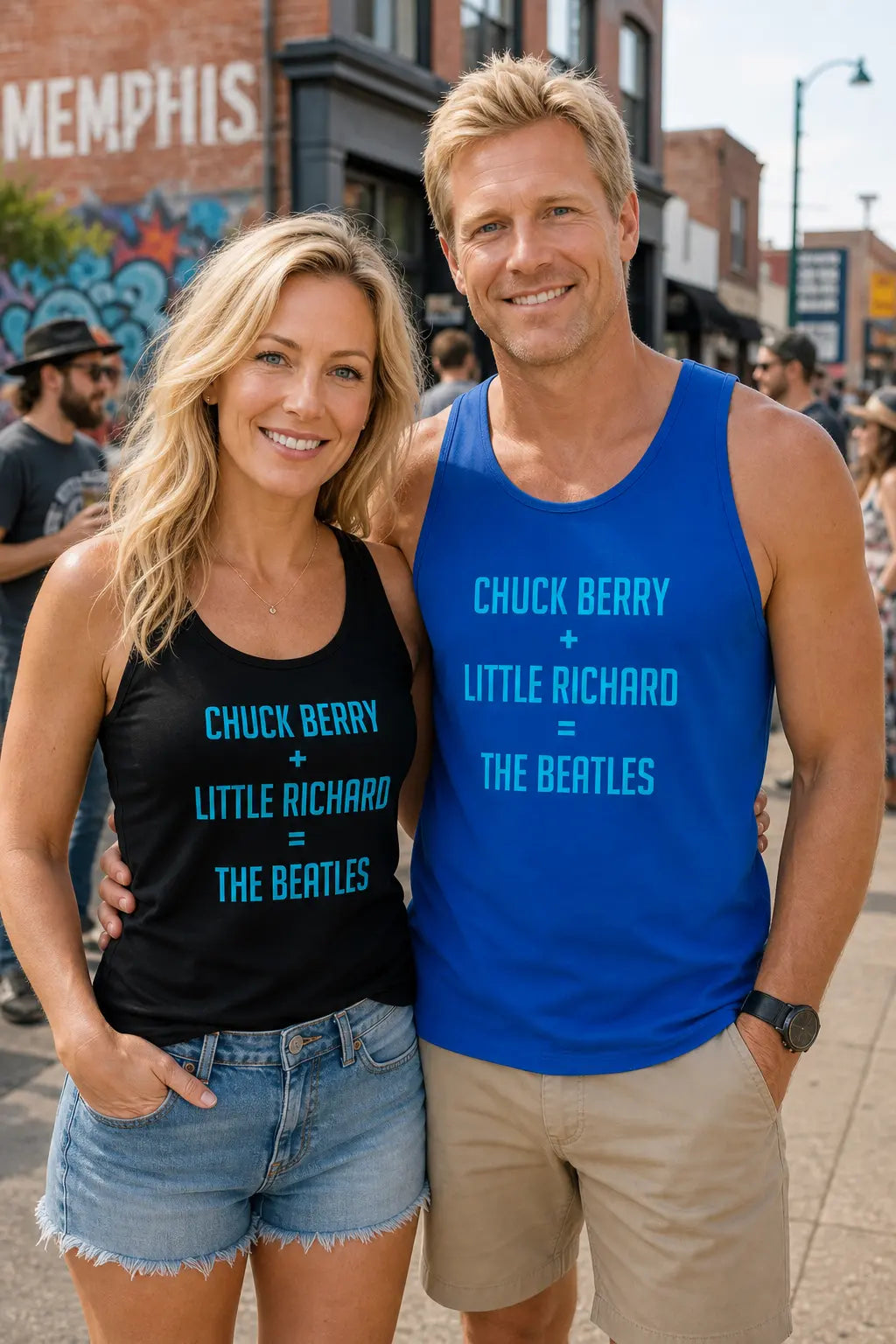 Two people wearing tank tops with music band references, standing on a street.