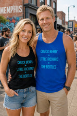 Two people wearing tank tops with music band references, standing on a street.
