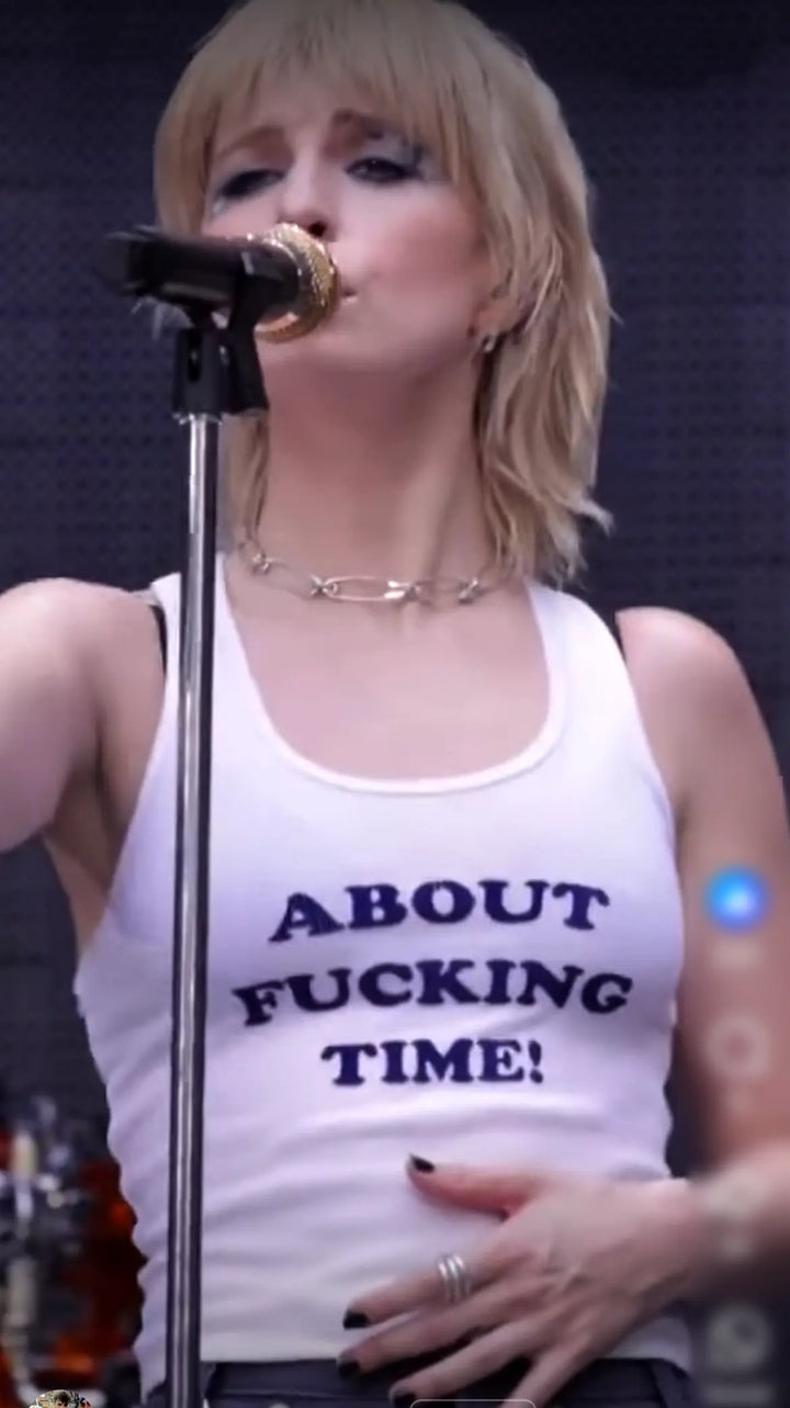 Hayley Williams of Paramore wearing "About Fucking Time!" tee shirt.
