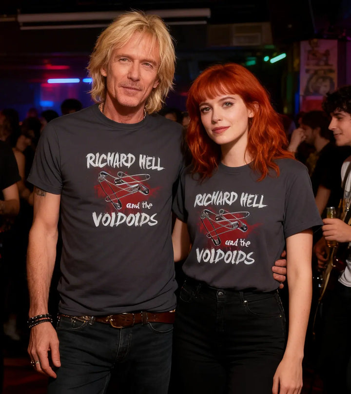 Two people wearing 'Richard Hell and the Voidoids' t-shirts in a club setting.