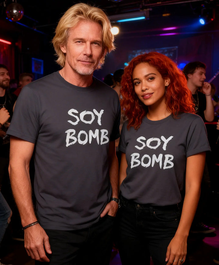 Two people wearing 'SOY BOMB' t-shirts in a social setting.