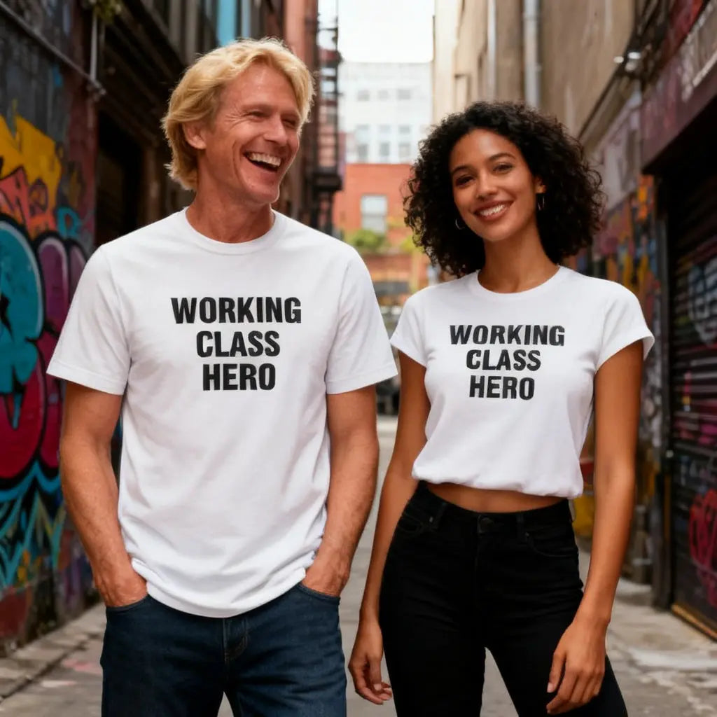 Two people wearing 'WORKING CLASS HERO' t-shirts in an urban setting.